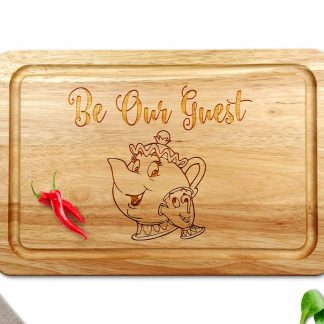 be our guest wooden chopping board on a white worktop