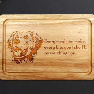 golden retriever chopping board on a dark worktop