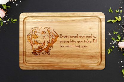 golden retriever chopping board on a dark worktop