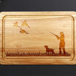 female pheasant shooting chopping board with labrador on grey worktop