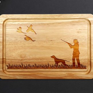 female pheasant shooting chopping board with Pointer on grey worktop