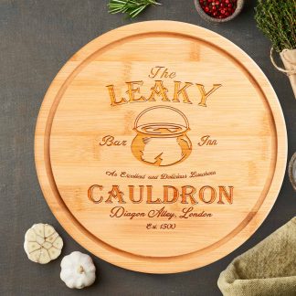 the leaky cauldron round chopping board on grey worktop