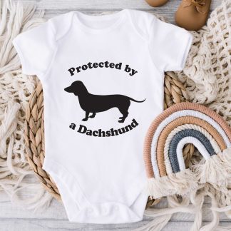 protected by a Dachshund white onesie