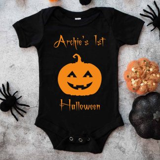 Black baby's first halloween onesie on a spooky background